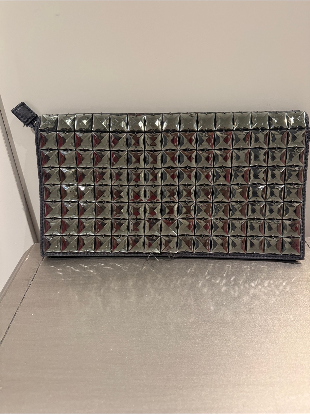 silver studded steel grey clutch with Pyramid Studs